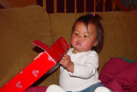 Kasen opening an early Christmas present from Aunt Debbie